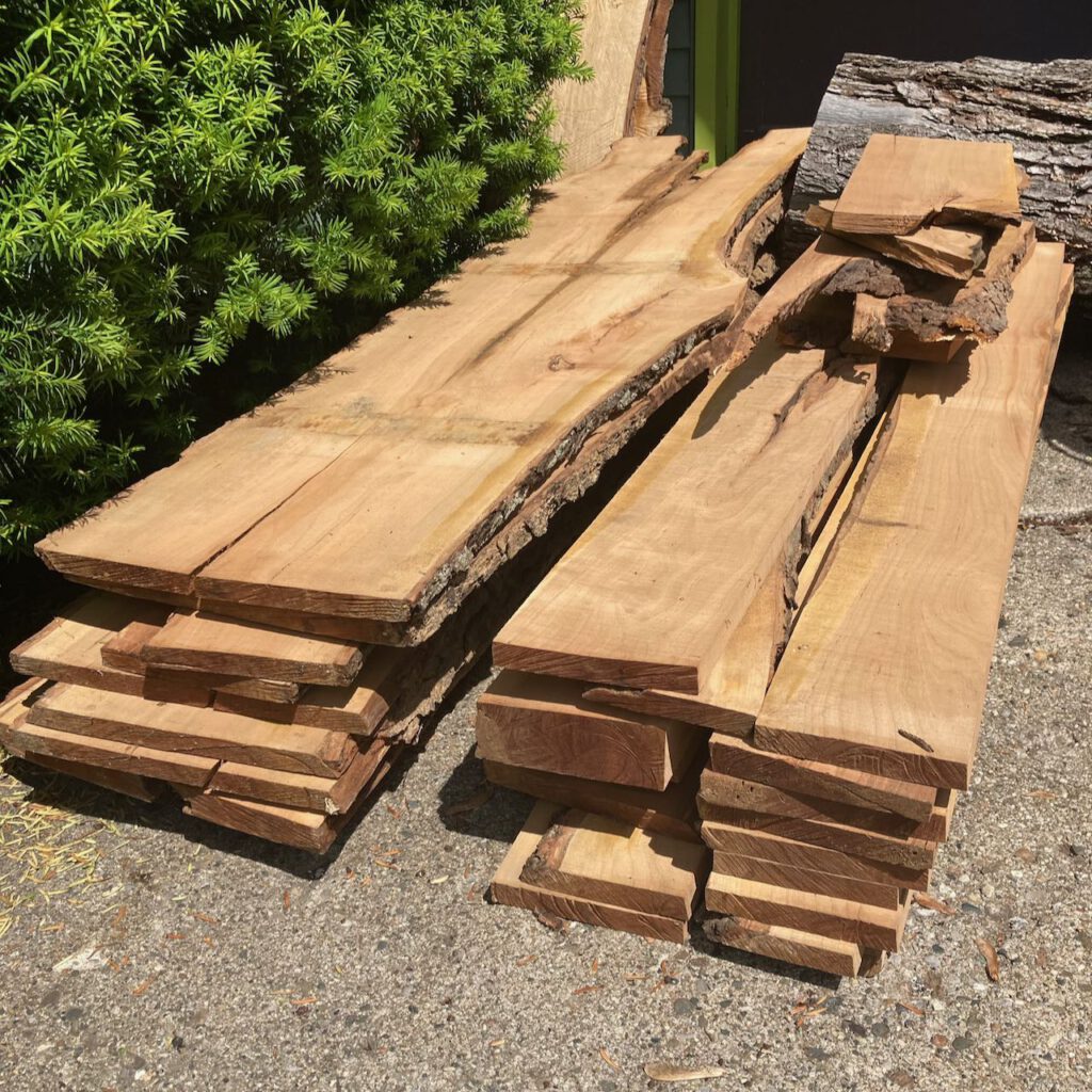 Stacks of rough-sawn planks of cherry wood
