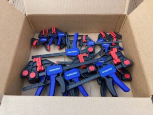 a box of clamps, each labeled with the Workpro brand name