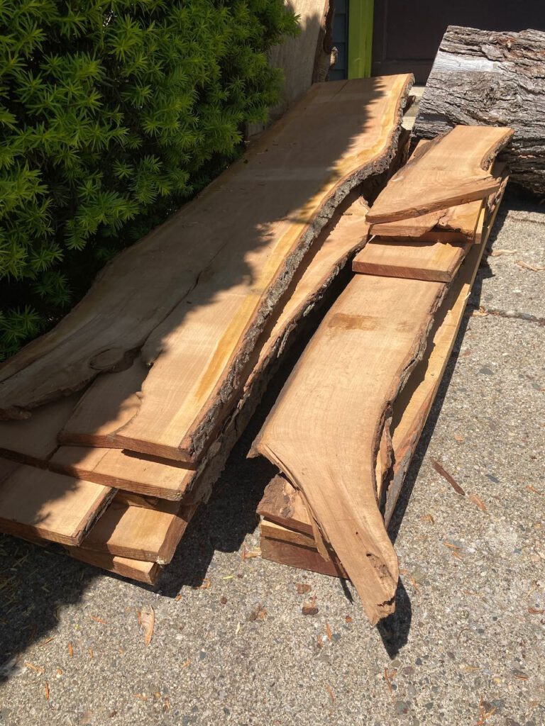 Stacks of rough-sawn planks of cherry wood